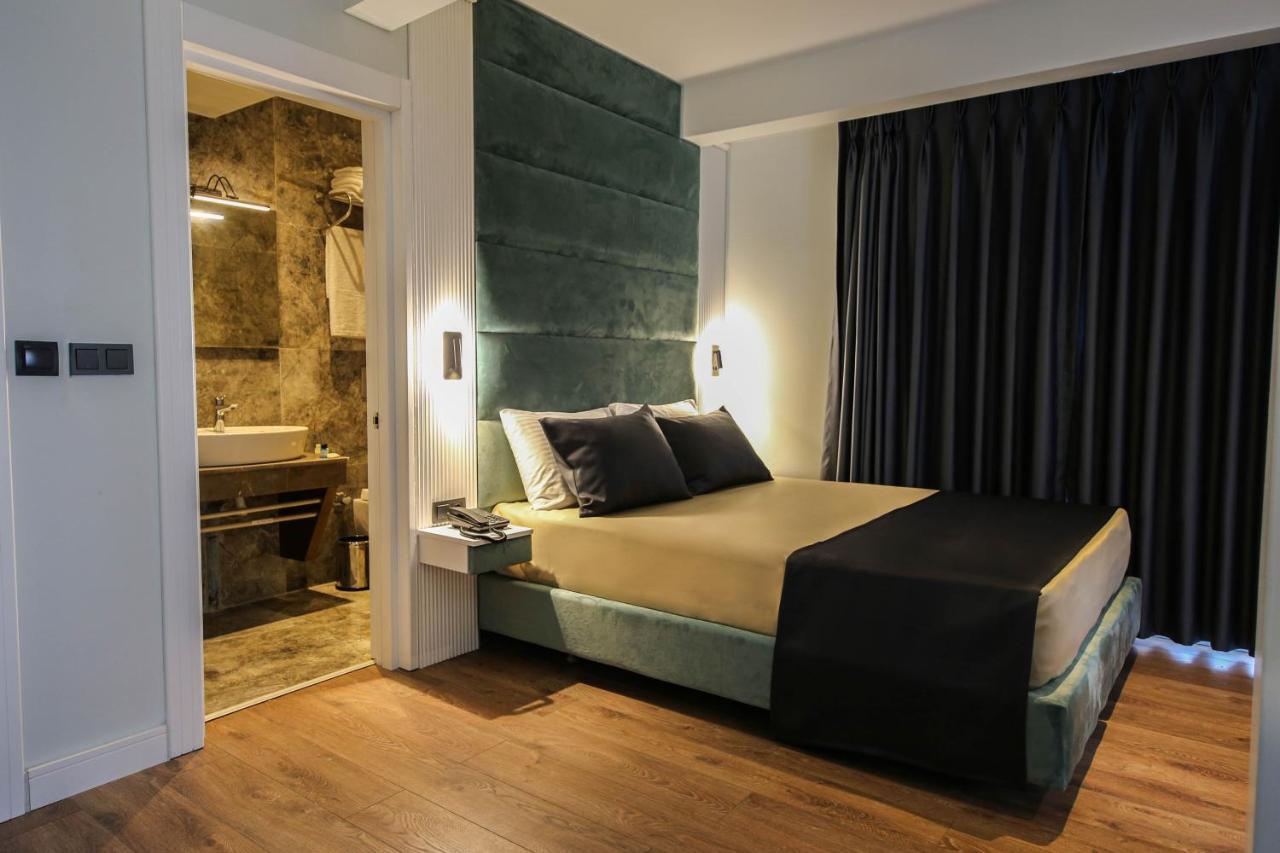 Axu Airport Hotel Arnavutkoy المظهر الخارجي الصورة A bedroom in a hotel